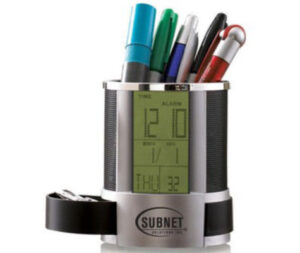 clock with pens being held in it, great swag